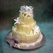 Wedding Cake with Chocolate Panels And White Lilies