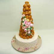 Profiterole on Cake with Pink Flowers
